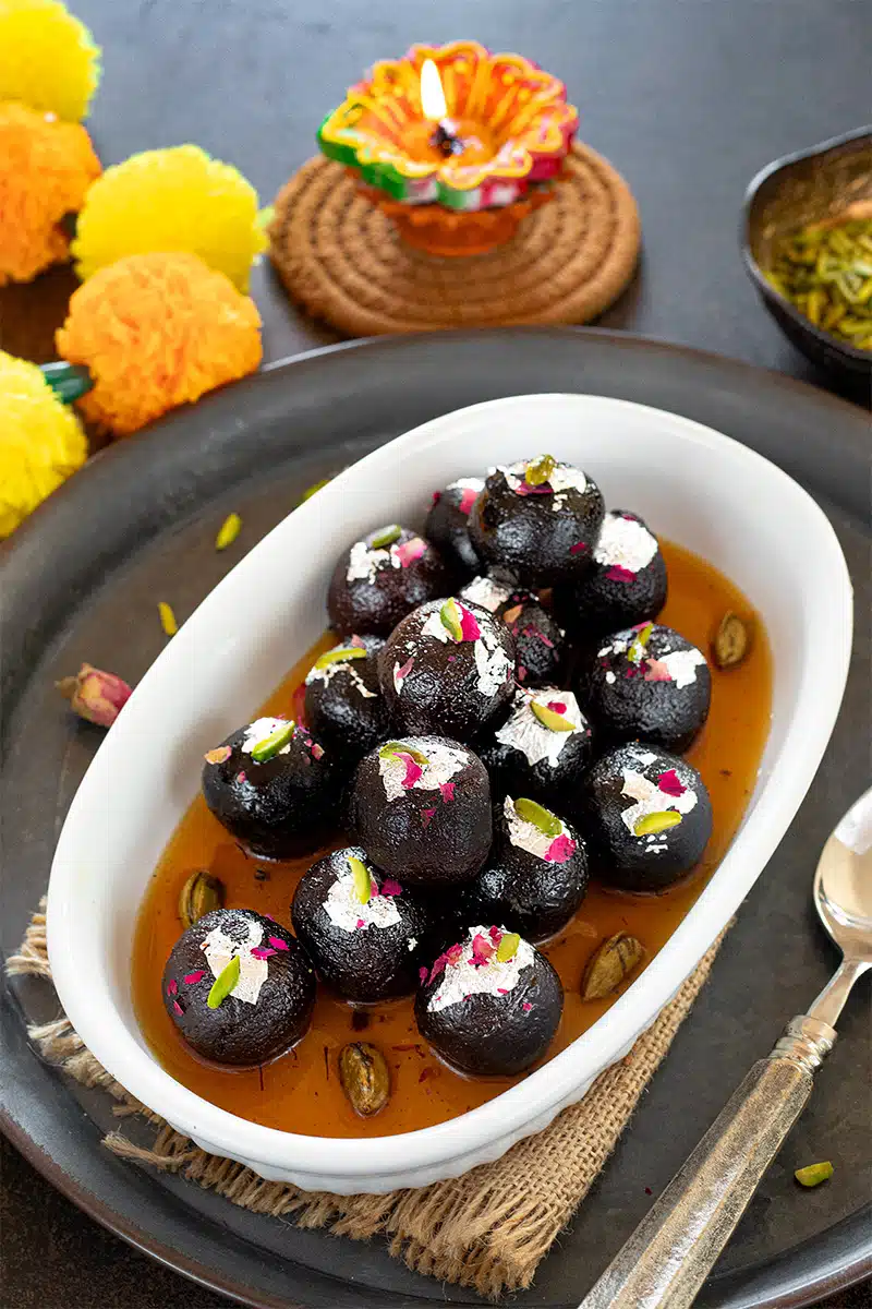 Black Gulab Jamun in a bowl