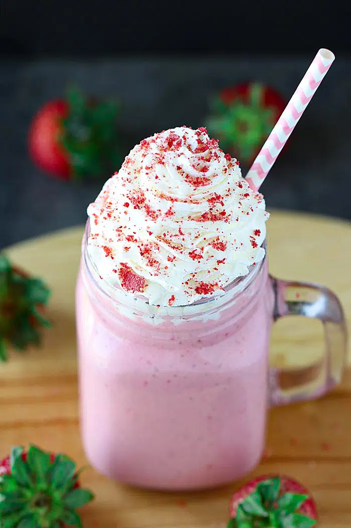 Strawberry Shake with frosting and straw
