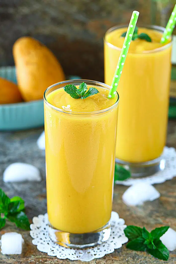 White wine mango slushie in tall glasses