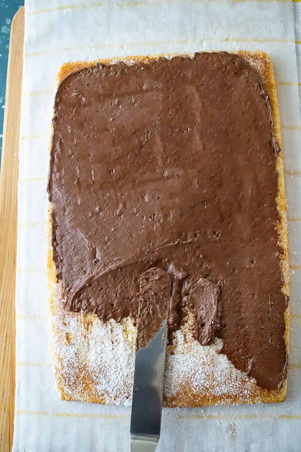 Spread the frosting on log cake