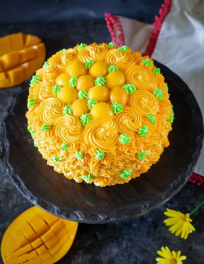 Decorated eggless mango cake