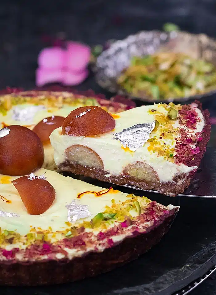 Cut slice of Gulab Jamun tart