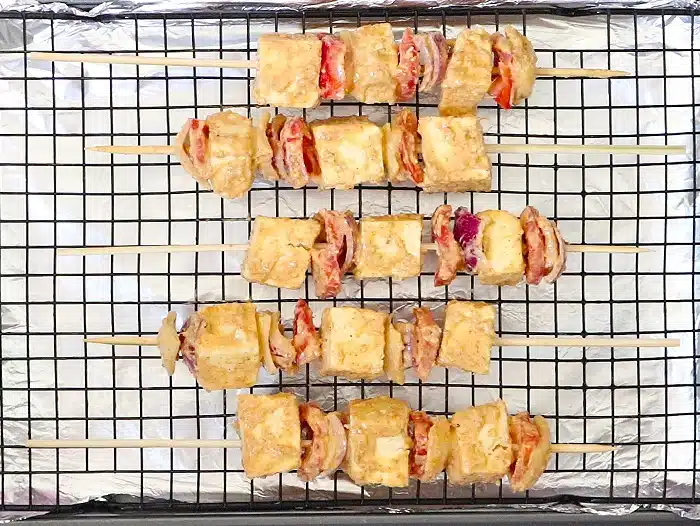 Arrange skewers on a baking tray