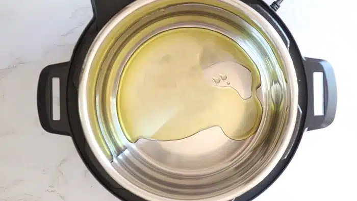 Add oil to Instant Pot