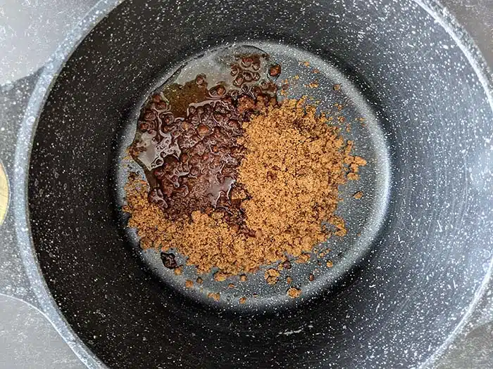 Jaggery and water in a pan