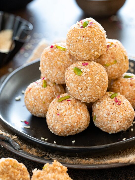 Stacked til ladoos on a plate