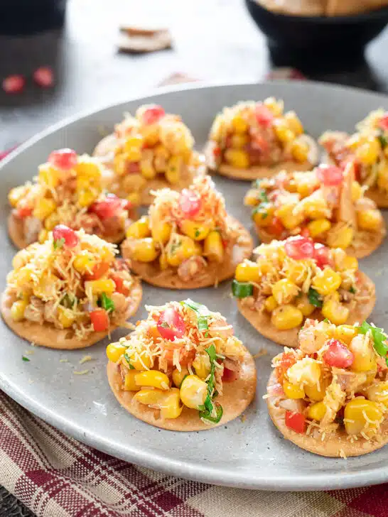 Corn Masala Chaat spread on papadis